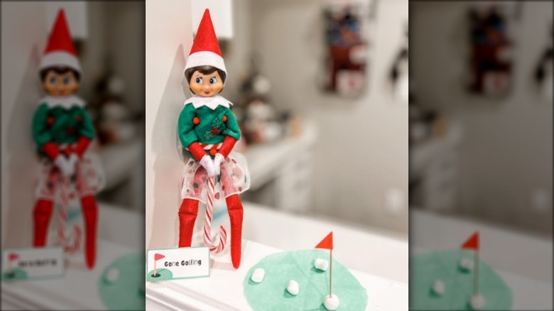 Elf on Shelf playing golf