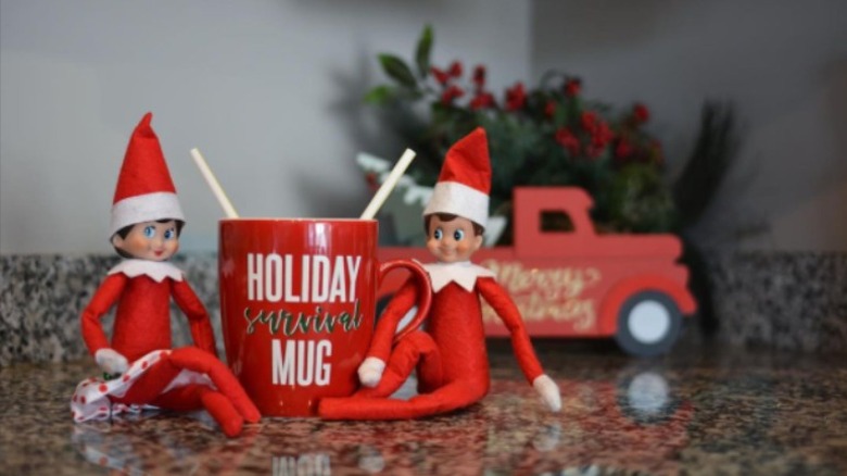 Elves on counter with mug