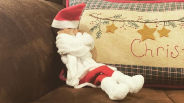 Bundled elf on couch