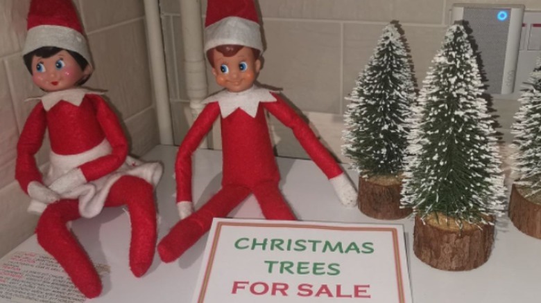 Elves selling Christmas trees