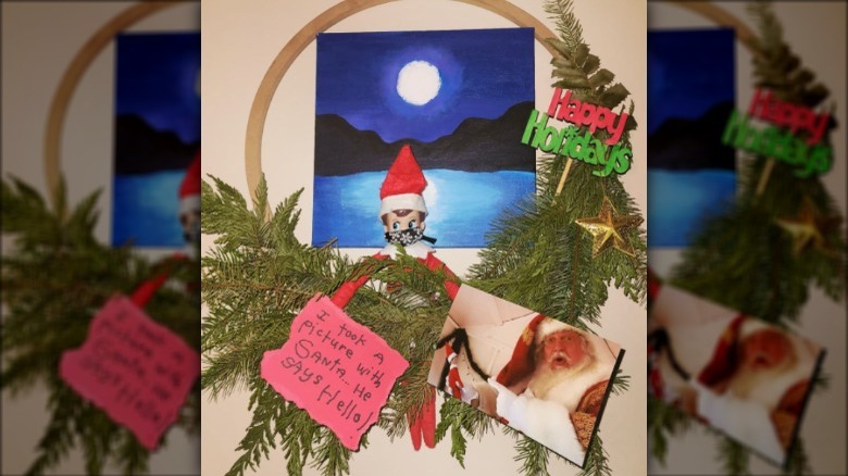 The elf with a Santa photo