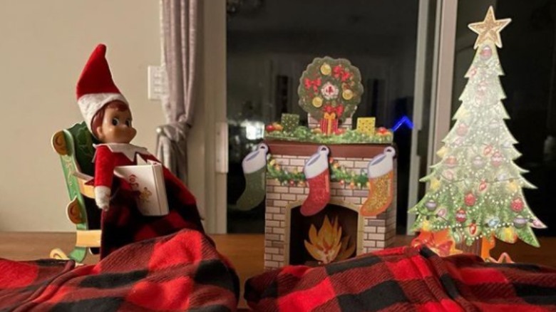 Elf by a faux fire