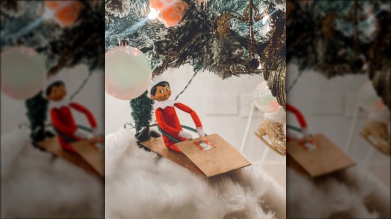 Elf on gift bag sled