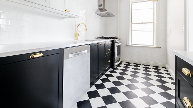 black cabinets with checkerboard floors