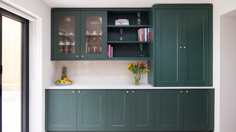 kitchen with dark green cabinets