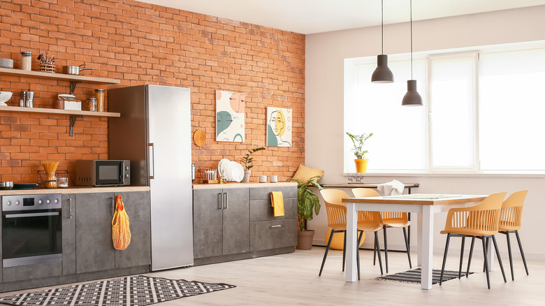 kitchen with exposed brick