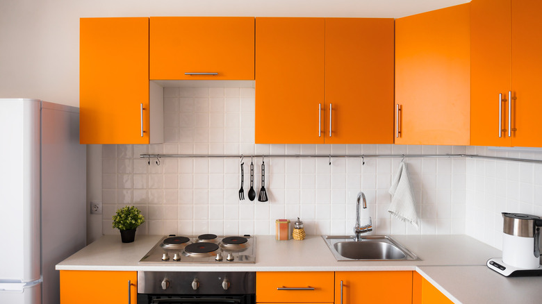 kitchen with orange cabinets