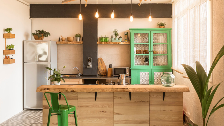 green cabinet in kitchen