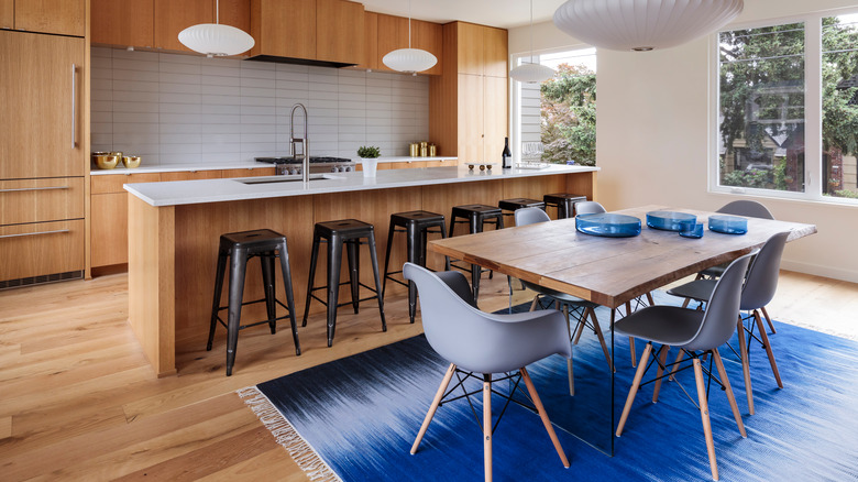 wood kitchen with blue rug