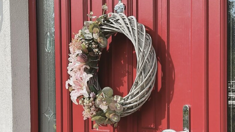 Painted grapevine wreath on door