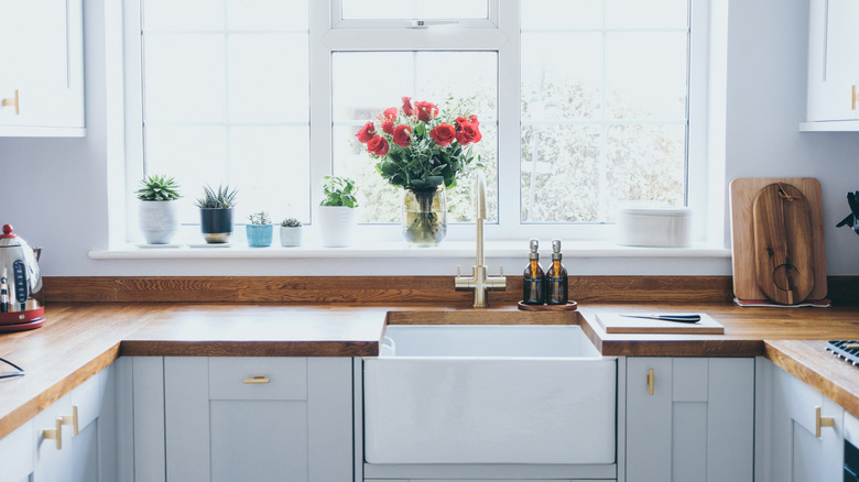 Bright icy blue cabinets in kitchen