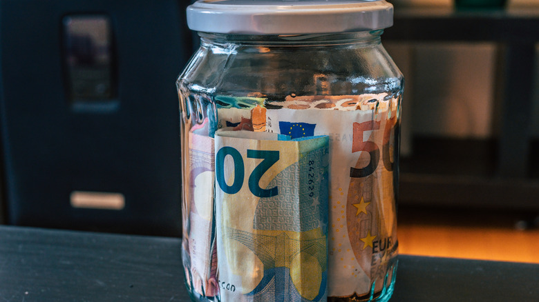 money in glass jar