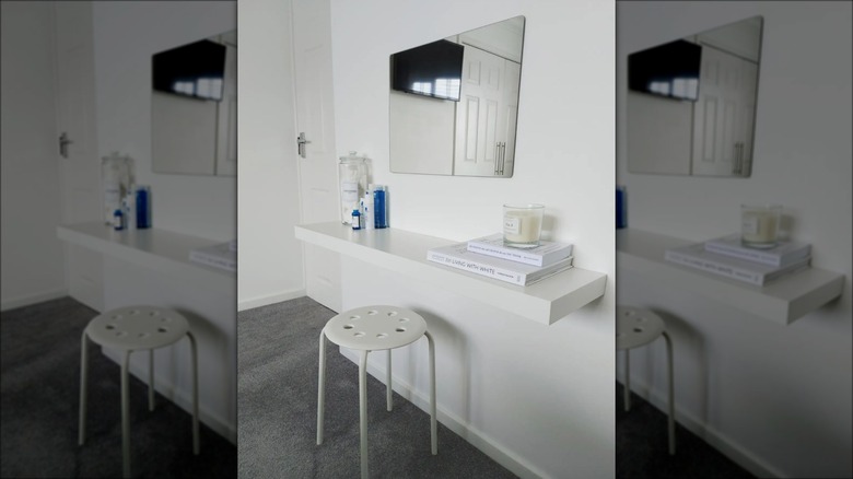 white floating shelf with mirror