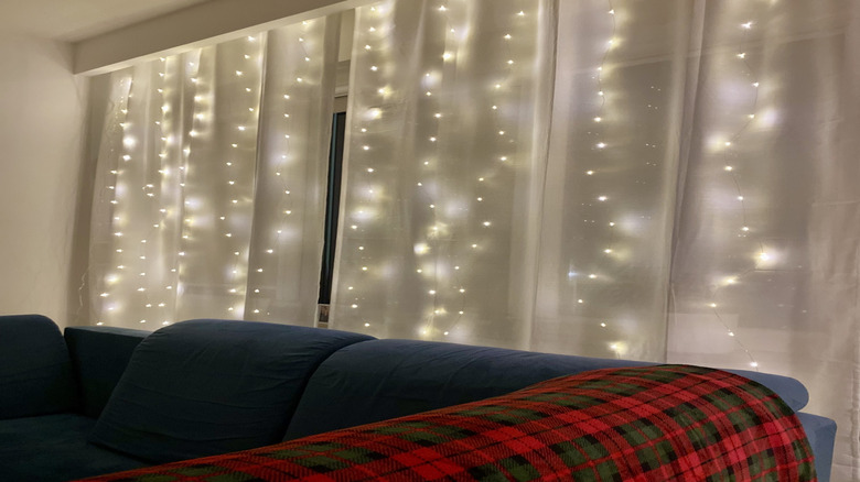 Sheer curtains decorated with fairy lights