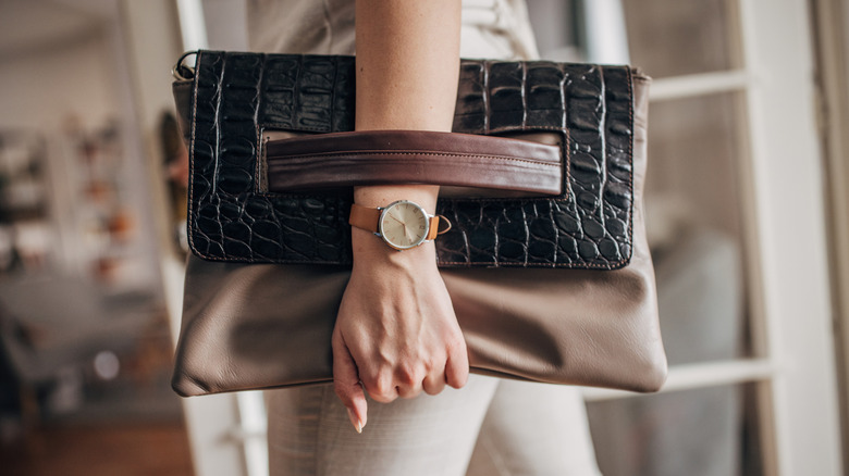 Someone holding a leather purse