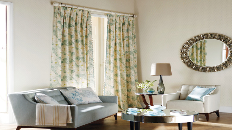 Living room with yellow and green botanical curtains