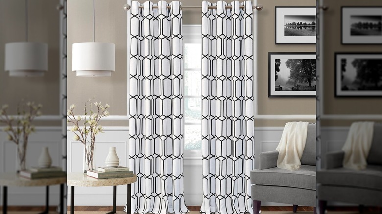 Living room with curtains in geometric black and white pattern