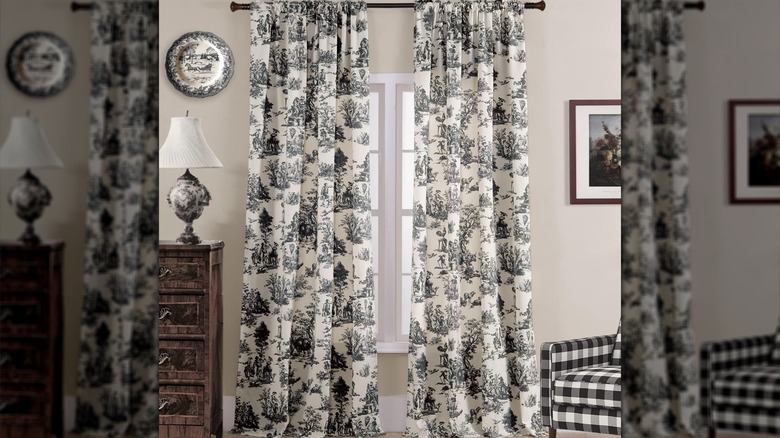 Black and white toile curtains in a living room