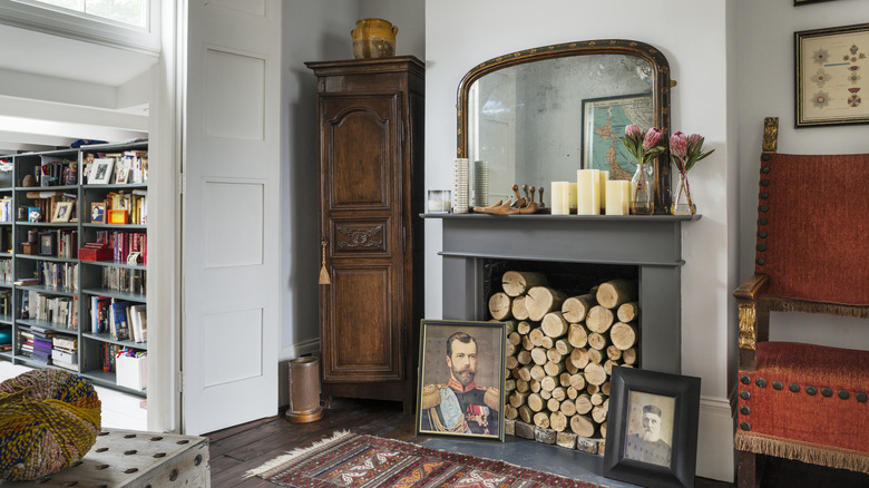 Old fireplace filled with wood