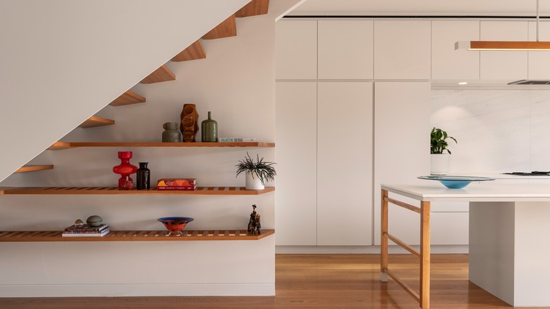 floating shelves under stairs