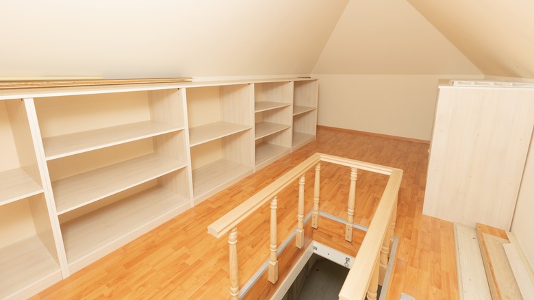 Attic with empty storage shelves