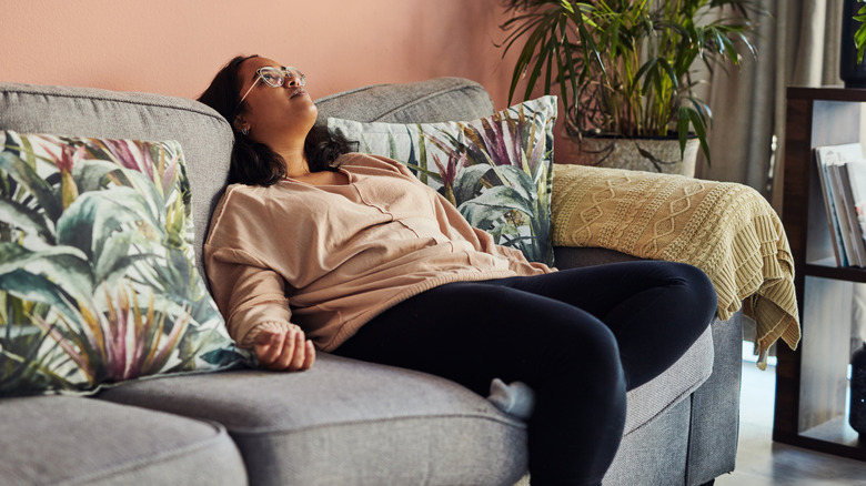 tired woman in living room