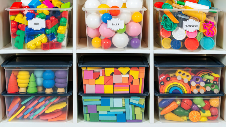 Stacked containers organizing toys