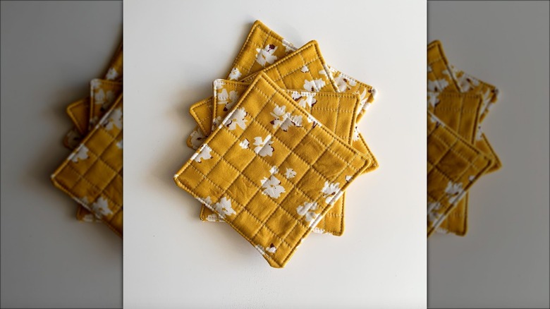 square yellow quilted fabric coasters