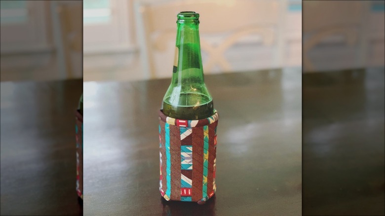 brown and teal quilted koozie