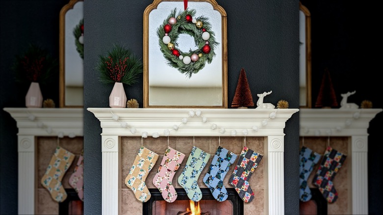 quilted stockings hanging on fireplace