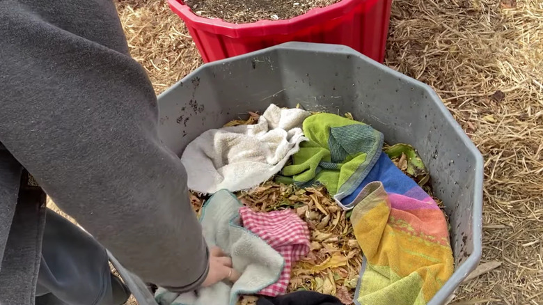 towels in large plant pots