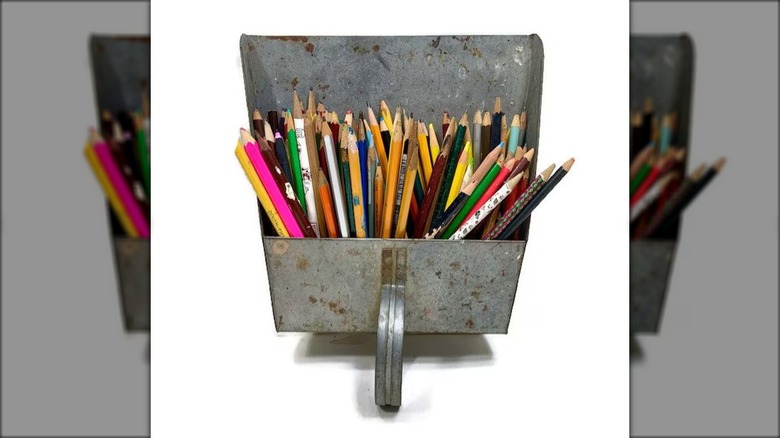 pencils in dustpan