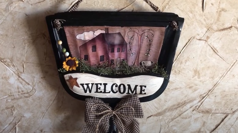 dustpan welcome sign