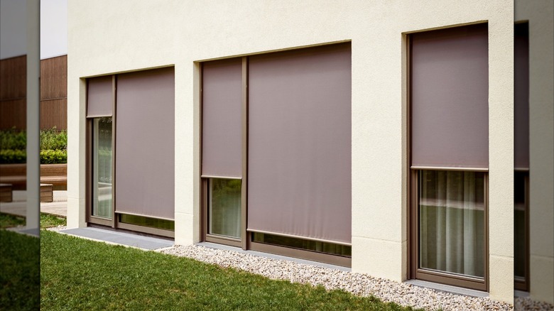 Exterior window blinds on windows in home