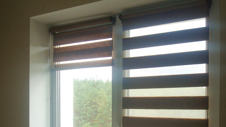 Brown zebra shades on two narrow windows