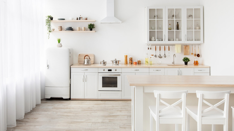 Kitchen with white cabinets and appliances