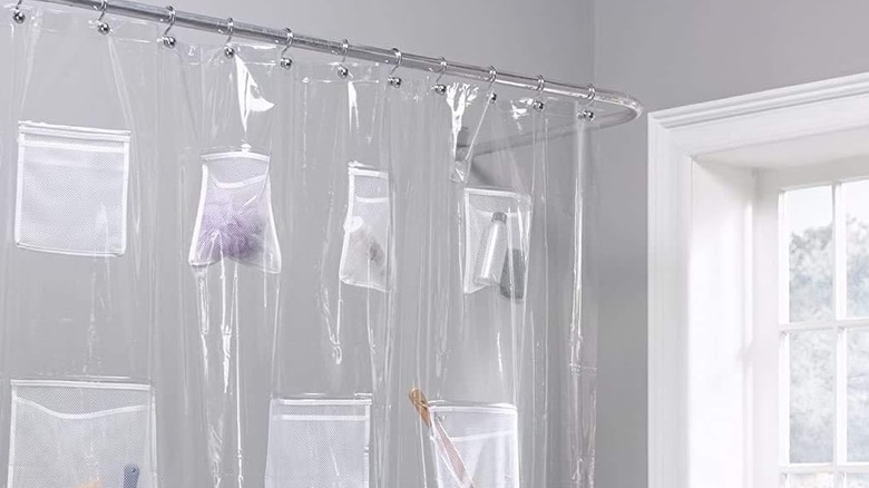 A shower curtain with pockets for storing beauty products and shower accessories