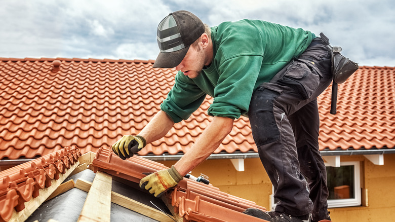 roofer on clay roof