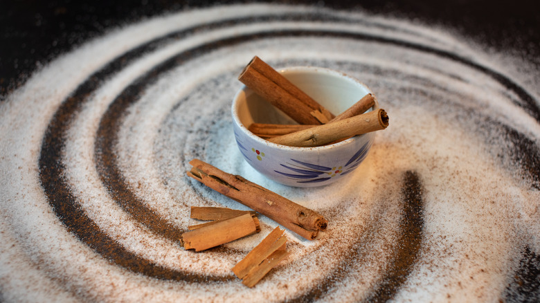 sugar and cinnamon spill on table