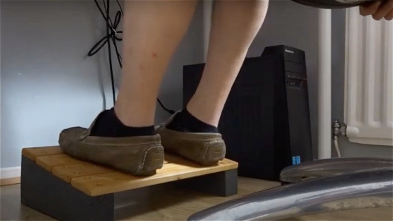 feet on wooden foot rest