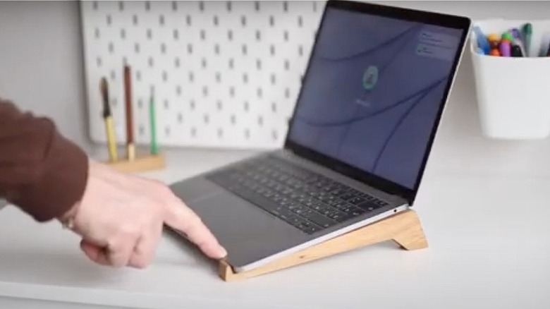 laptop on wooden stand