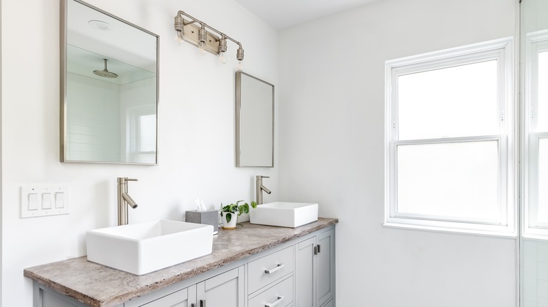 Bathroom with dual sinks and granite countertop