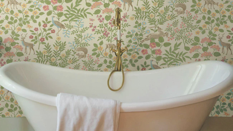 bathtub and floral wallpaper 