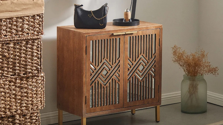 wood cabinet with geometric mirrored doors