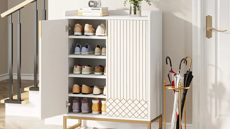 white and gold shoe cabinet