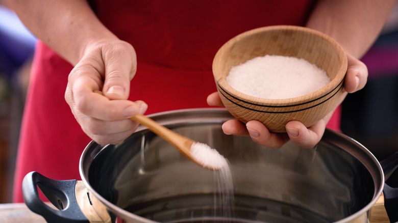 Man with bowl of salt