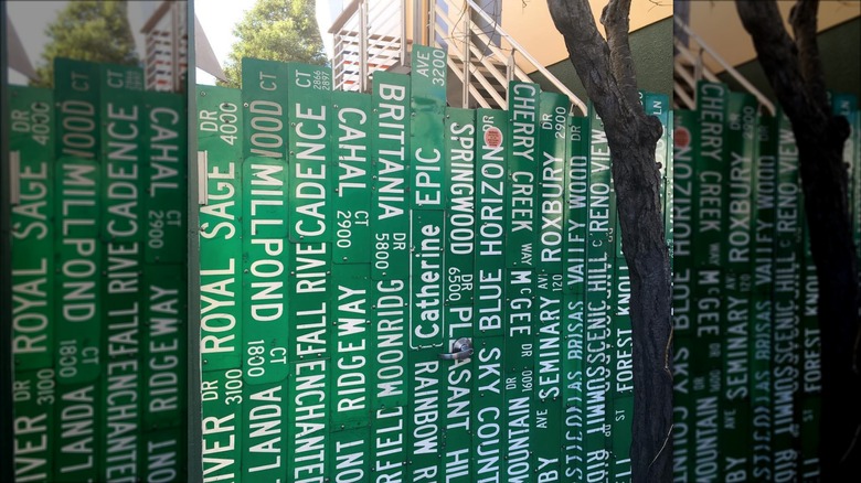 repurposed green road sign fence