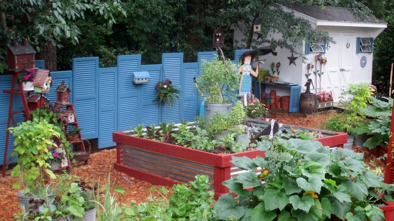 blue repurposed shutter garden fence