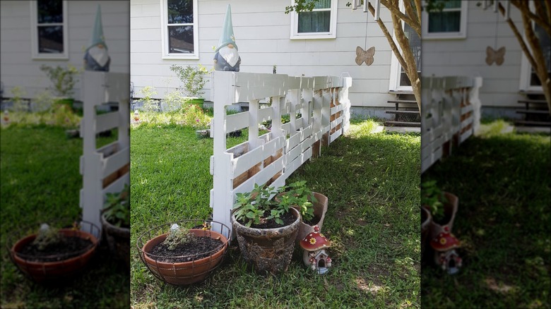 white painted pallet fence