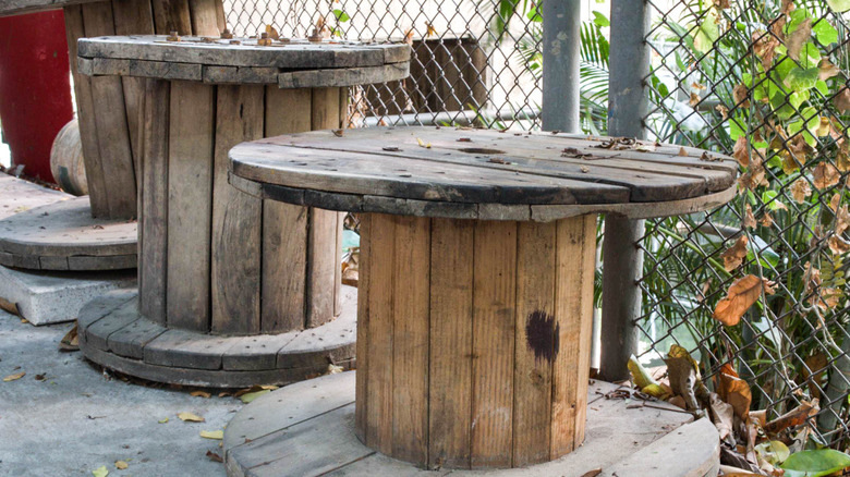 large wooden cable spools outside